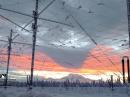 A section of the HAARP antenna field at sunset, with Mt Drum in the distant background.